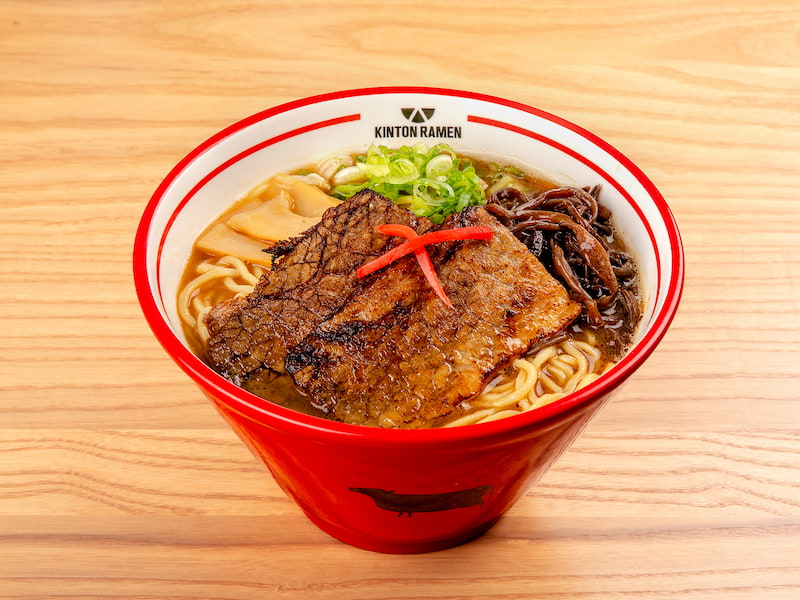 A bowl of Beef Shoyu ramen, featuring succulent beef slices, savory broth, and fresh toppings, served at Kinton Ramen.