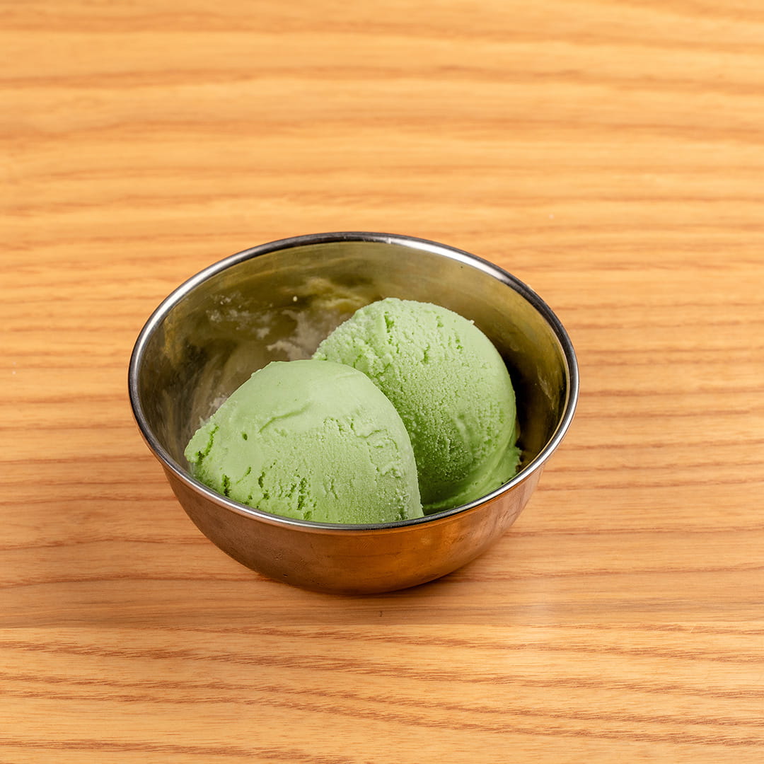 Matcha ice cream served in a bowl, showcasing a rich green color and creamy texture, a perfect dessert option at Kinton Ramen.