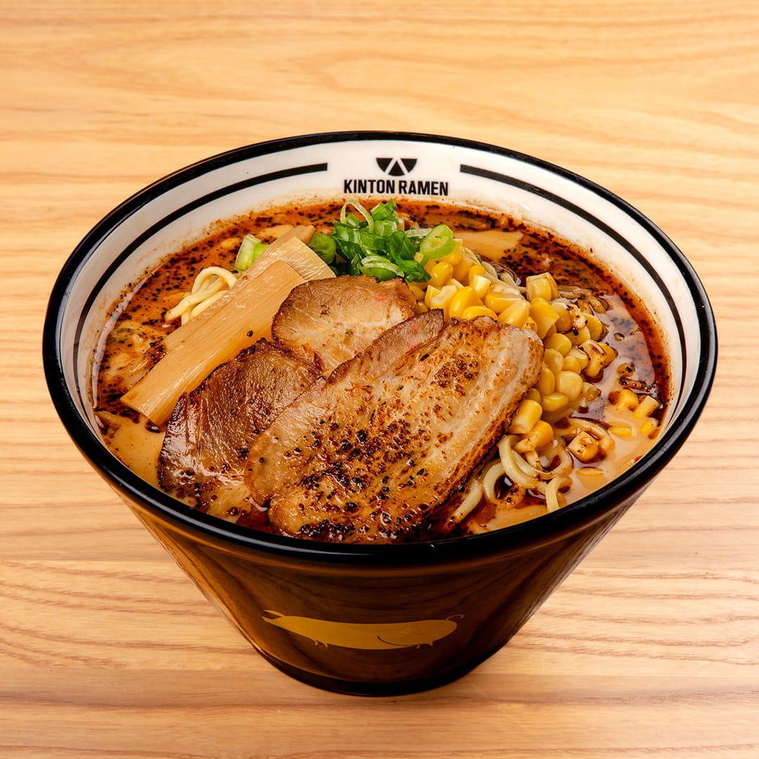 A rich bowl of Pork Miso ramen, featuring tender pork slices, savory miso broth, and fresh toppings, served at Kinton Ramen