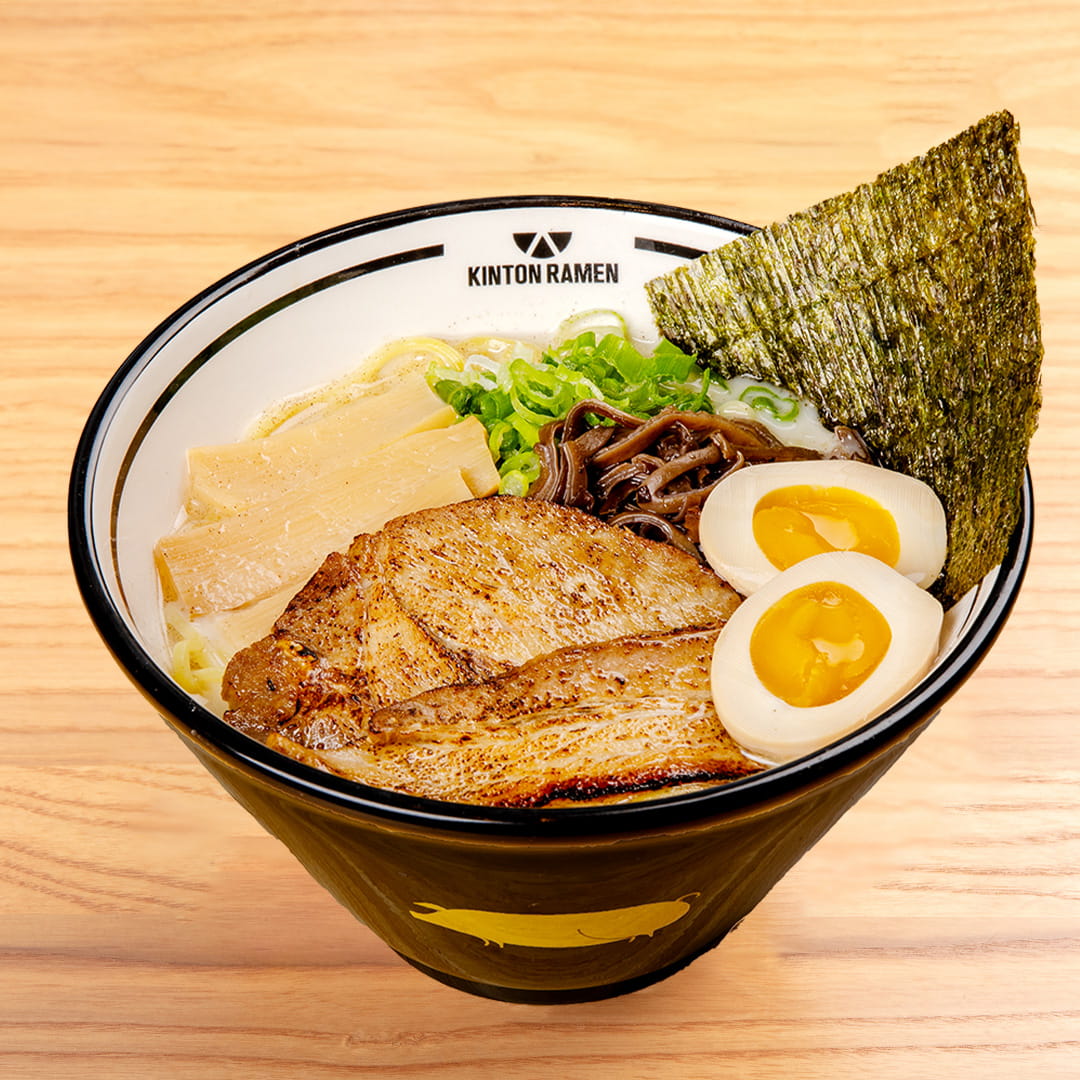 A flavorful bowl of Original Pork ramen, featuring tender pork slices, rich broth, nori, and fresh toppings, served at Kinton Ramen.