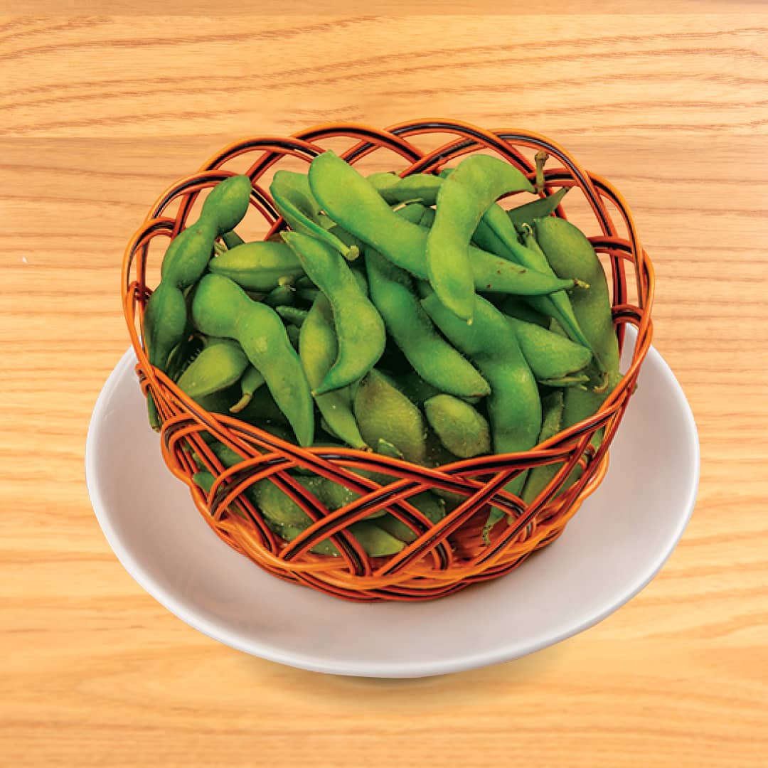 A bowl of steamed edamame lightly salted, served as a healthy side dish at Kinton Ramen.