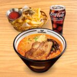 A delicious Kinton Ramen meal set for one, featuring a hearty bowl of ramen, fresh toppings, gyoza and a drink of your choice, perfect for an individual dining experience.