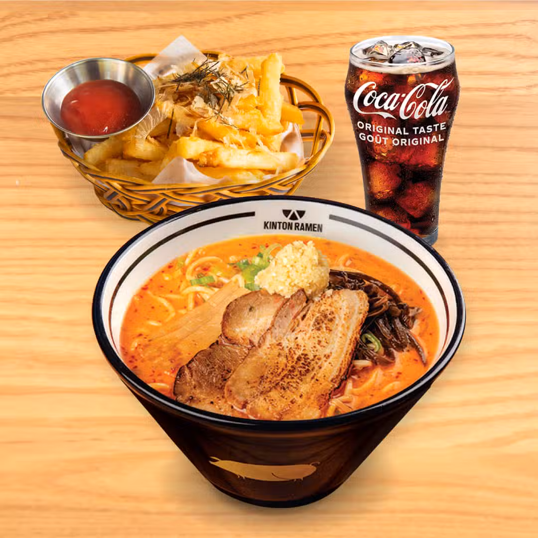 A delicious Kinton Ramen meal set for one, featuring a hearty bowl of ramen, fresh toppings, gyoza and a drink of your choice, perfect for an individual dining experience.