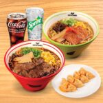 A Kinton Ramen meal set for two, featuring a variety of ramen bowls, fresh toppings, a portion of gyoza and 2 drinks of your choice, perfect for sharing a flavourful dining experience.